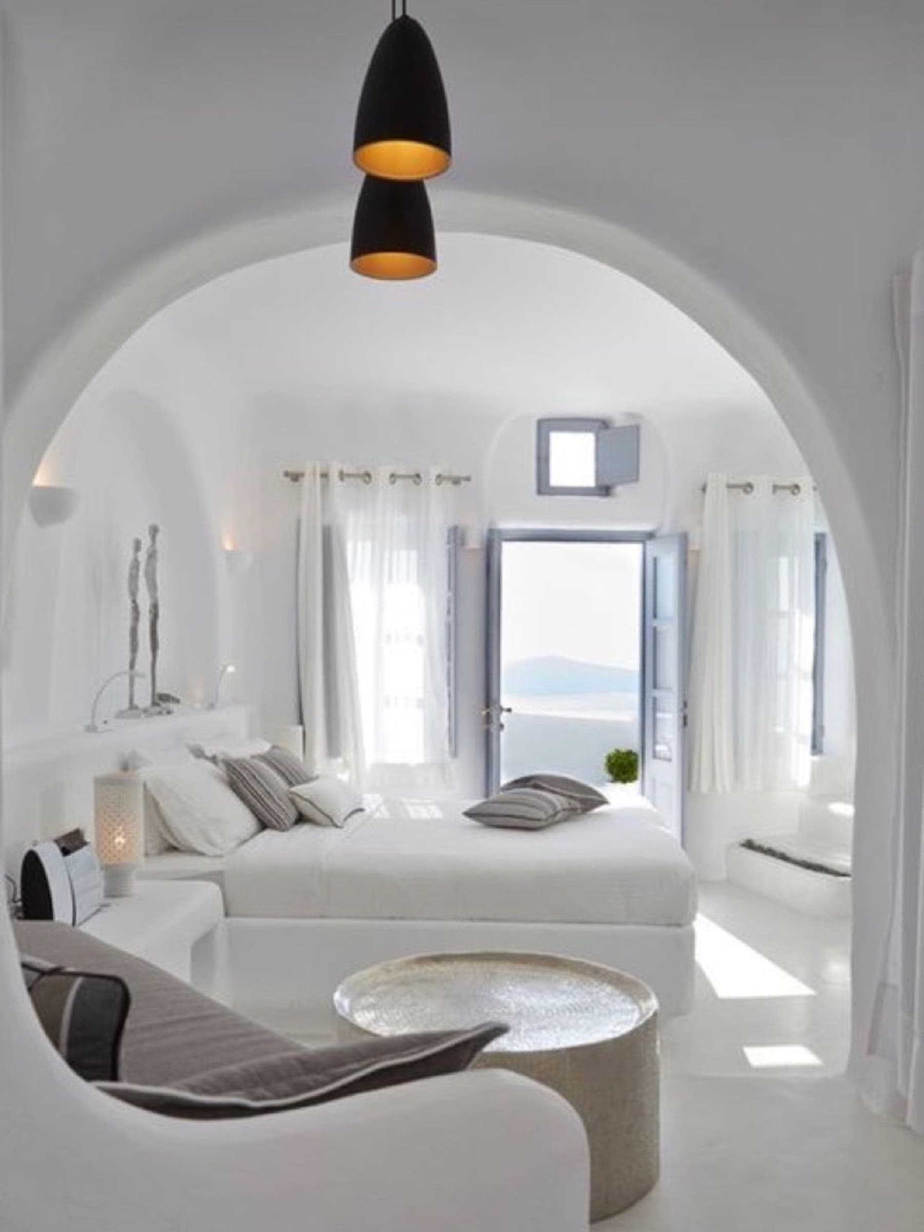 Hotel room interior reference: warm bedroom atmosphere with layered linens and natural materials